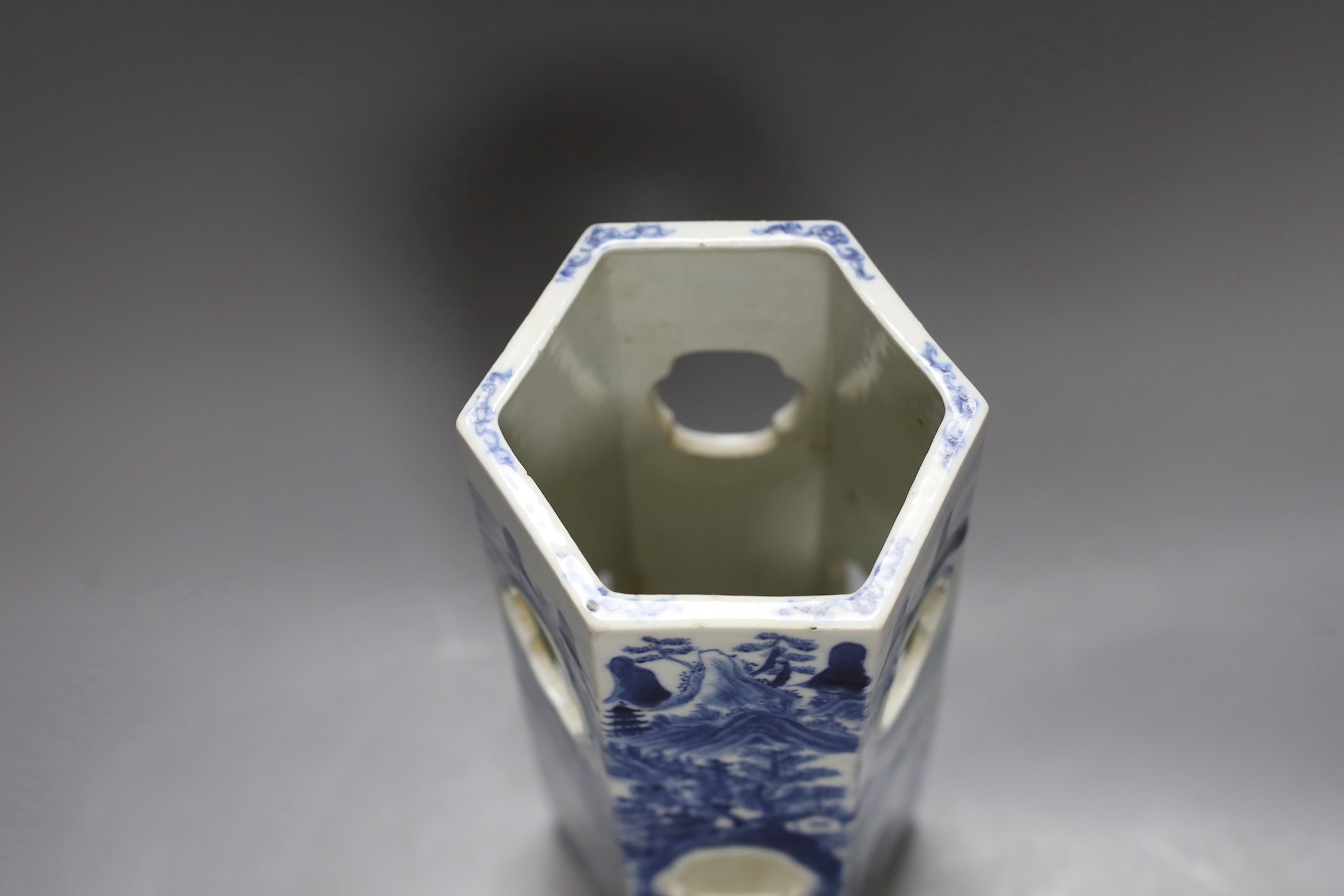 A Chinese blue and white hexagonal hat stand, late 19th century, 27.5 cms high, 27.2 cm high, hairline crack to one side of body